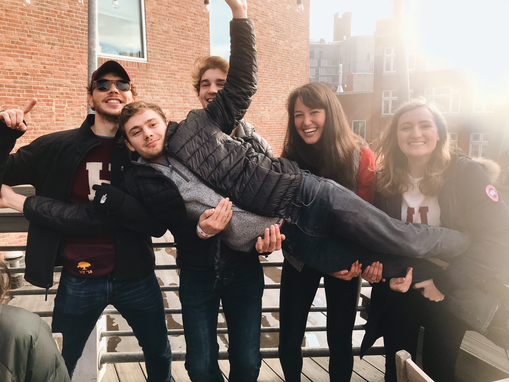 A group of friends posing together on outdoor steps